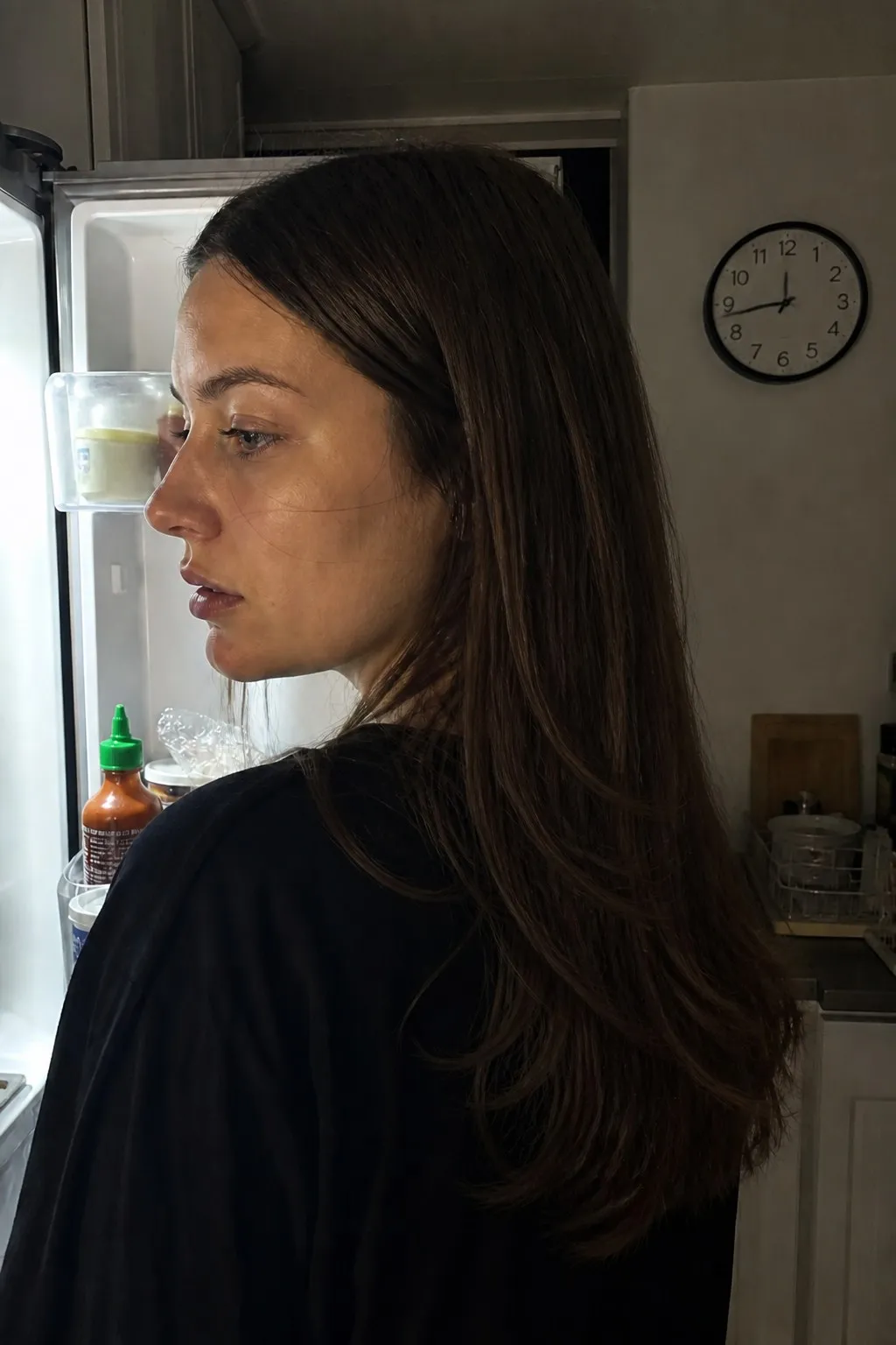 A woman with a square face before and after long layers - after
