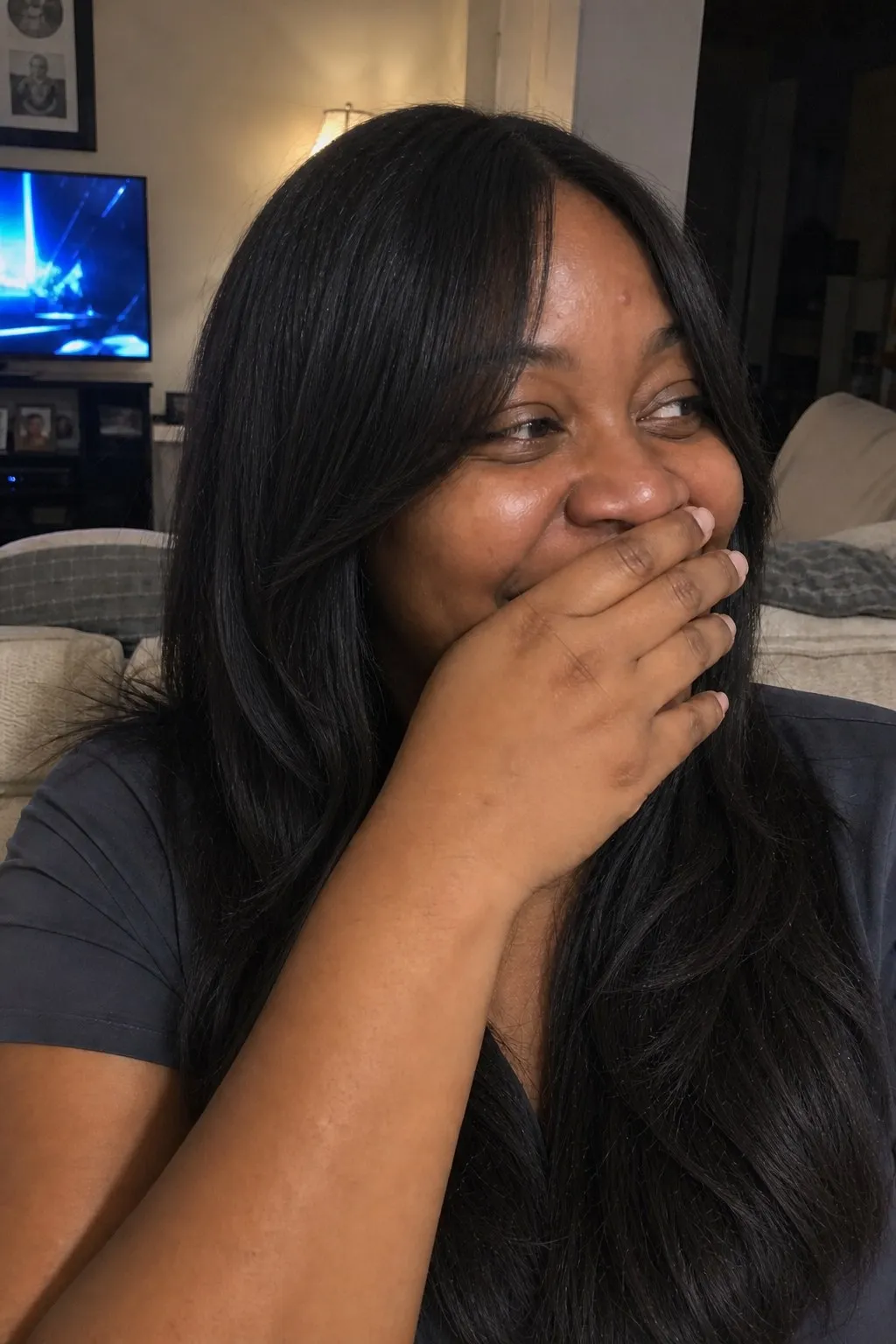 A woman with a round face before and after curtain bangs - after