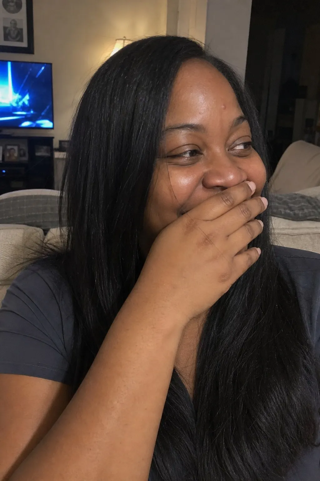 A woman with a round face before and after curtain bangs - before