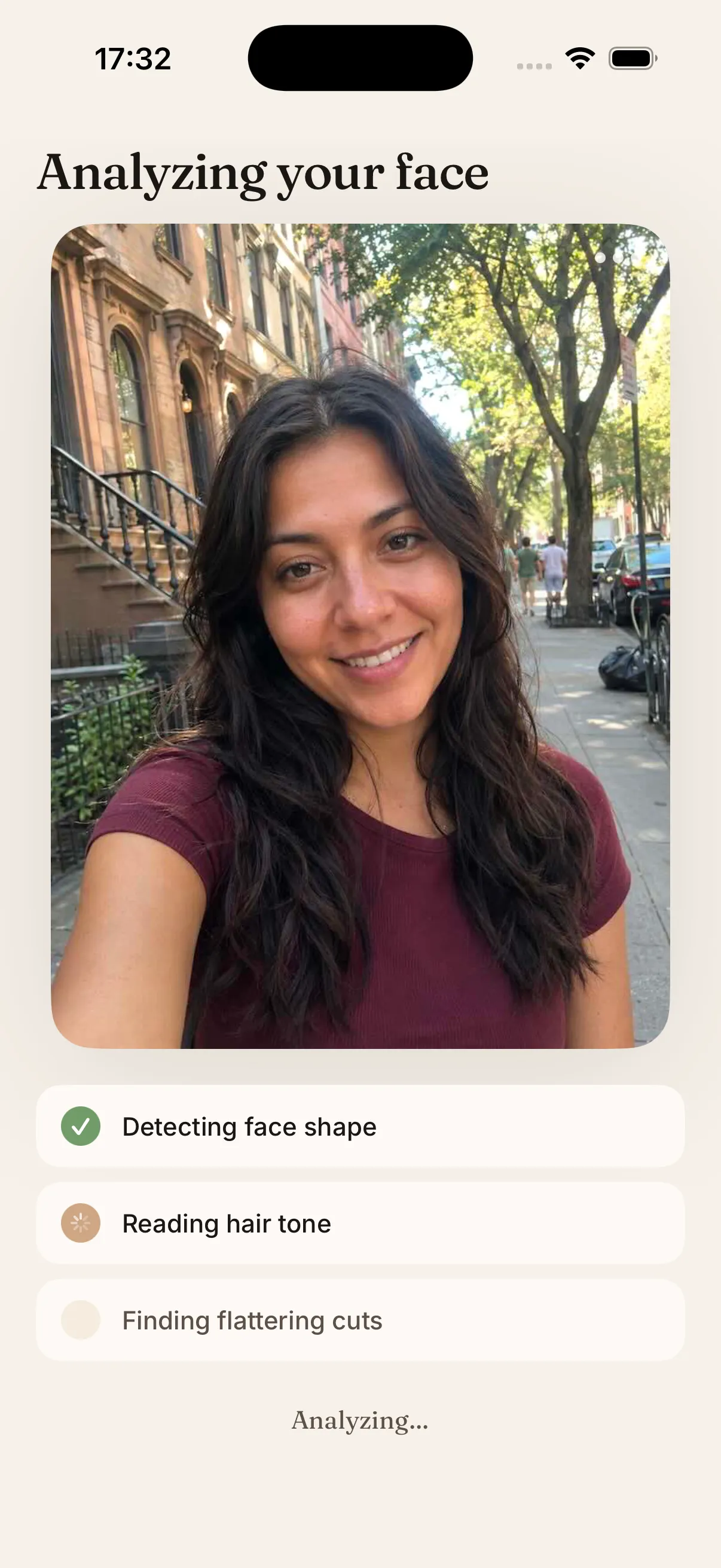 HaircutAI app screen showing AI face-shape analysis of a selfie